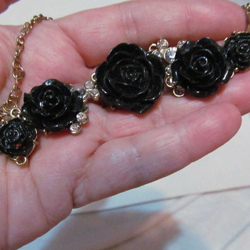 Woman's black roses gold tone chain necklace